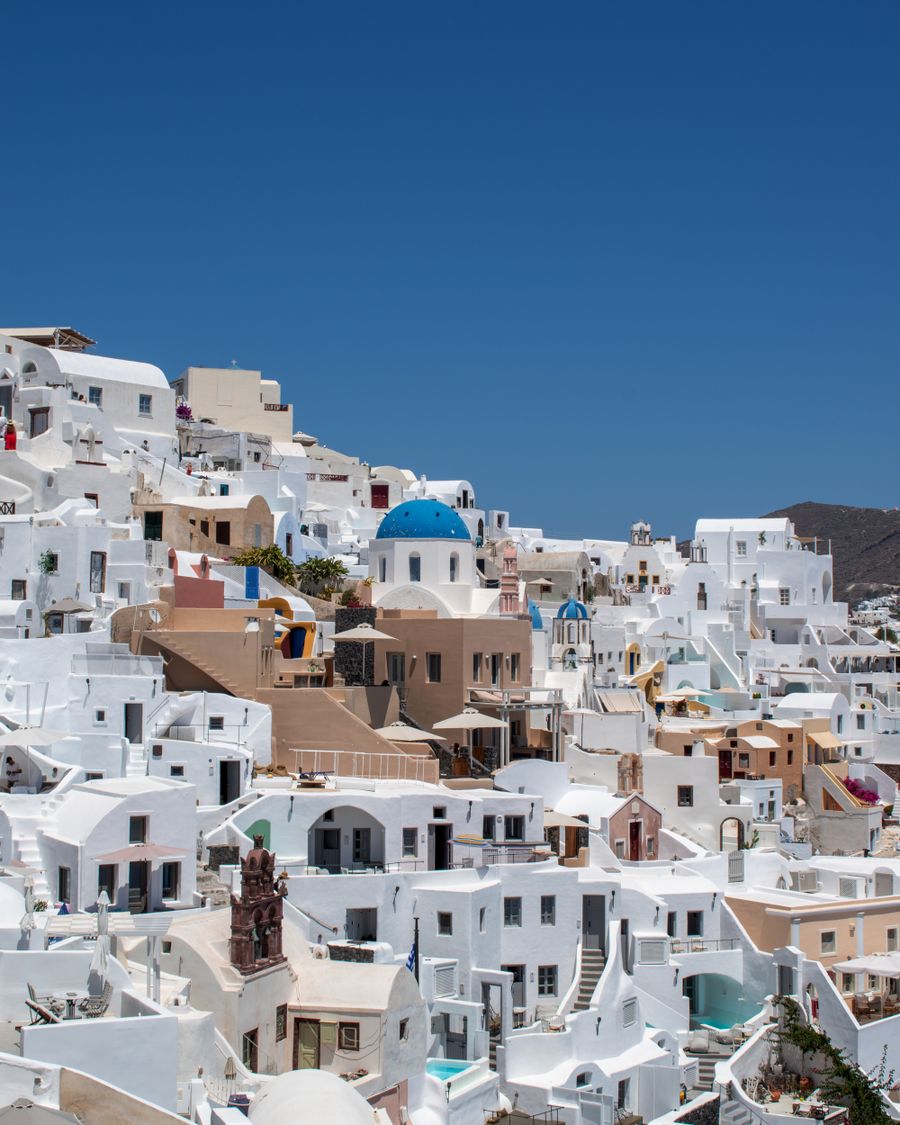 santorini under clear blue sky — My Active eSIMs remembers, so repeat travelers barely type.