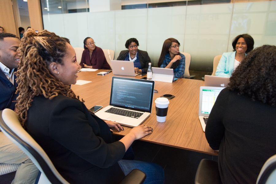 group of people using laptop computer