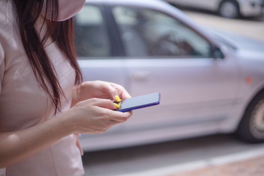 woman in pink blouse texting on a smartphone — Data Balance links every answer onward — usually the plan it recommends.