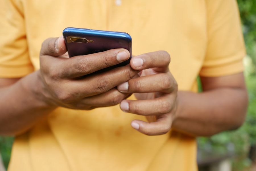 person holding blue smartphone