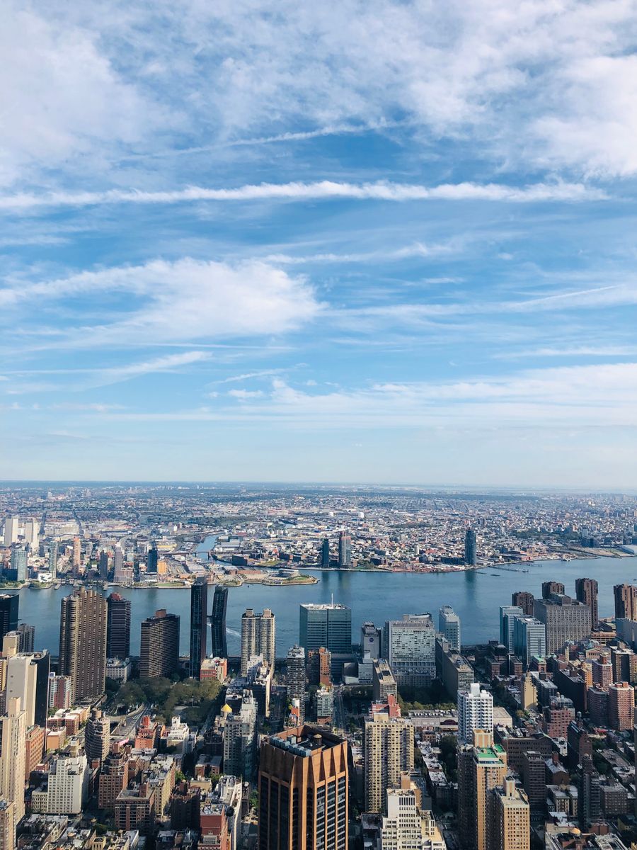 photo of the city against a cloudy sky — The business trip: client deck synced, video call joined from the taxi.