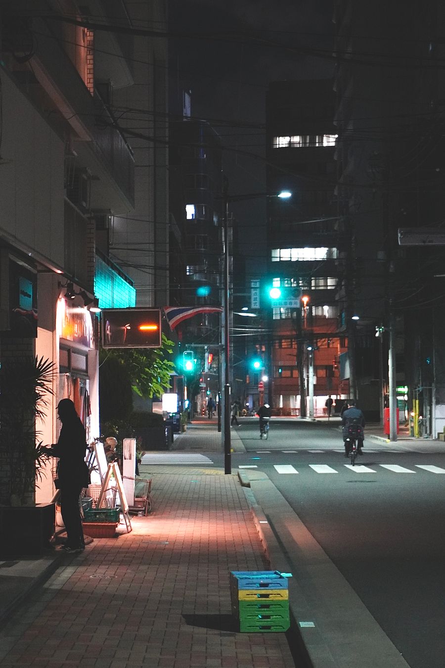 quiet tokyo night street scene with people — Trailheads and lookouts: offline maps downloaded, just in case.