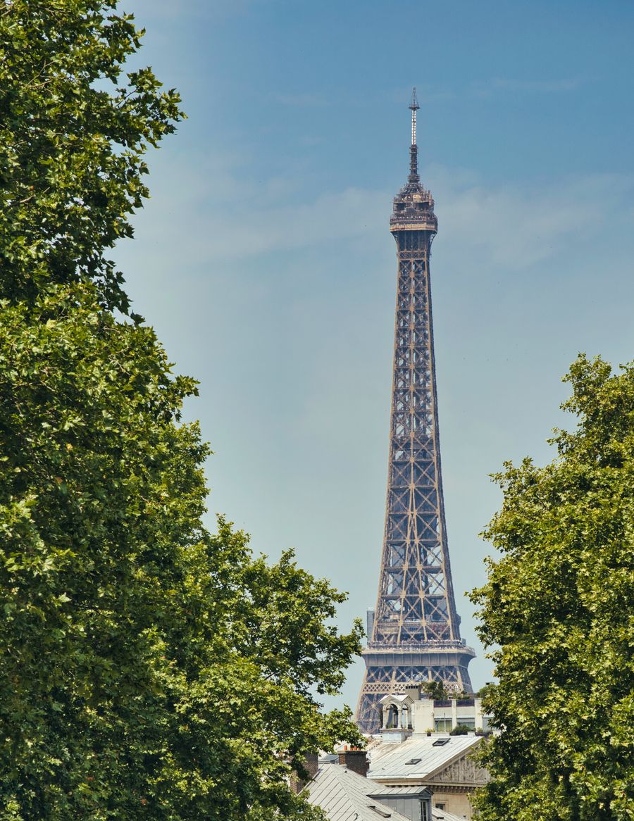 eiffel tower in paris framed by lush greenery — The pattern is honest: input, math, answer — the same on every tool.