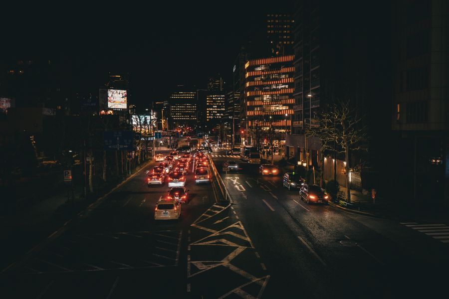 nighttime cityscape of tokyo streets — The sunrise ferry: tickets in the wallet app, timetable cached offline.
