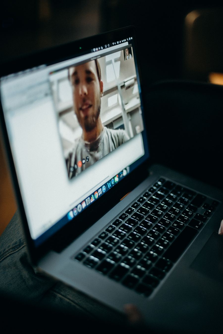 turned on macbook — Currency exchange, skipped: the phone pays at the real rate.