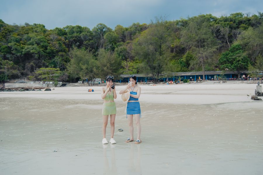 tourists enjoying a day at the beach — Border crossings without the paperwork shuffle: ID photos stored on the phone.