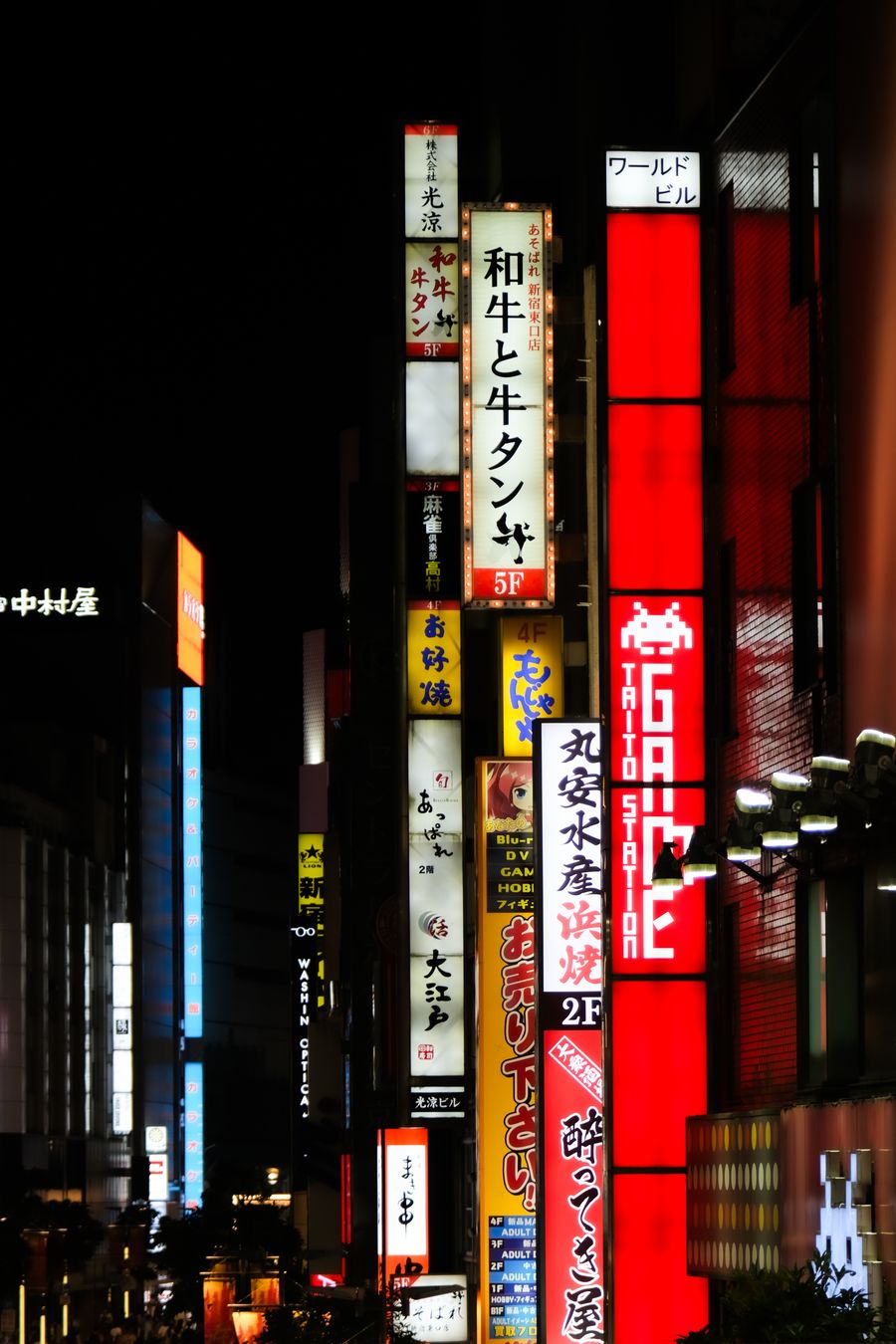 vibrant tokyo nightlife with neon signs — The conference badge: QR ticket scanned, session schedule synced.