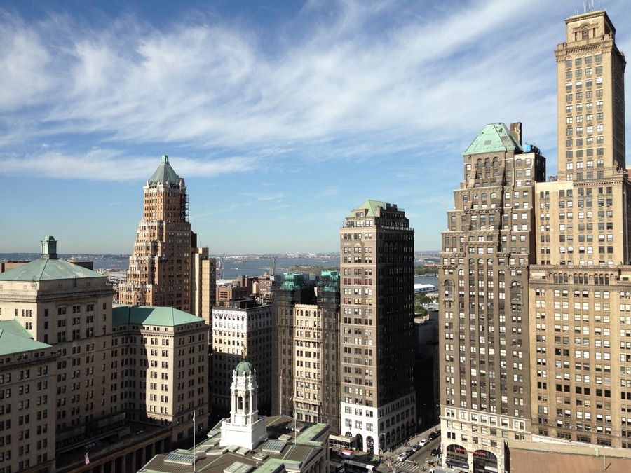view of brown and grey high rise building — キャリアが決して教えてくれないローミングの計算を、エージェントが解説します。