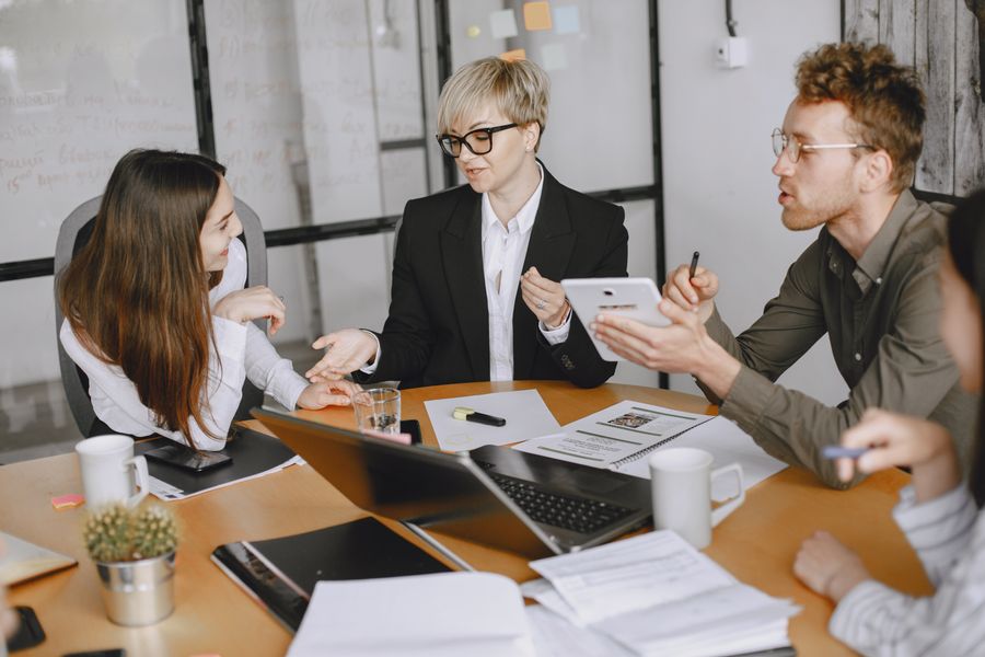 businesspeople brainstorming in conference room — APN Settings Lookup: the fastest way to turn a vague travel question into a next step.