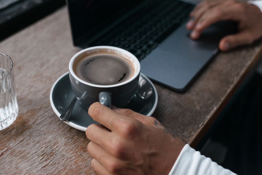close up shot of a person holding a tea cup