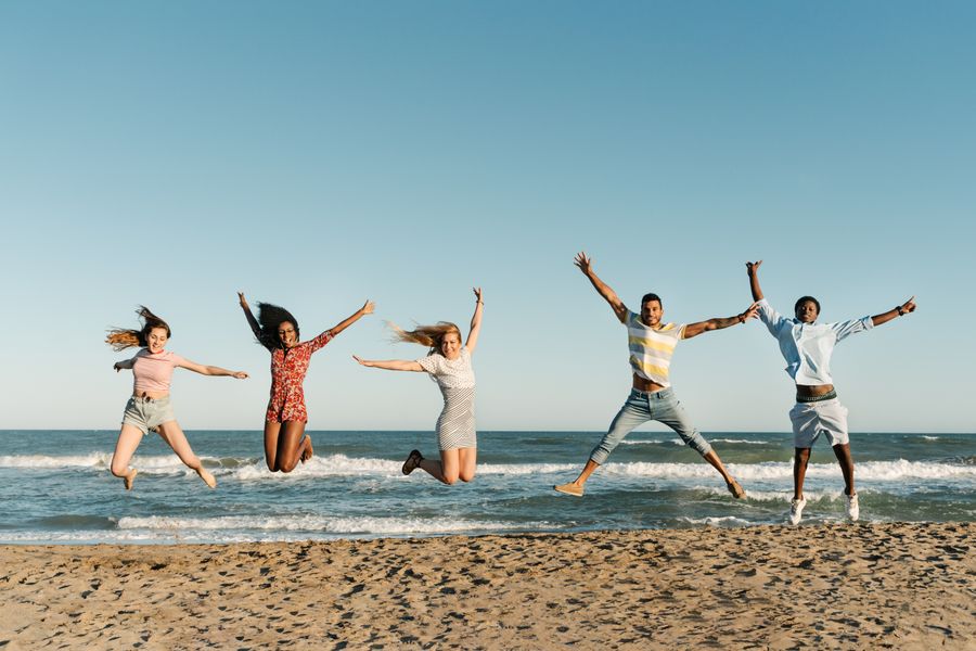 excited multiethnic friends jumping above sandy sea beach in summer — this tool: answers first, never a signup wall.