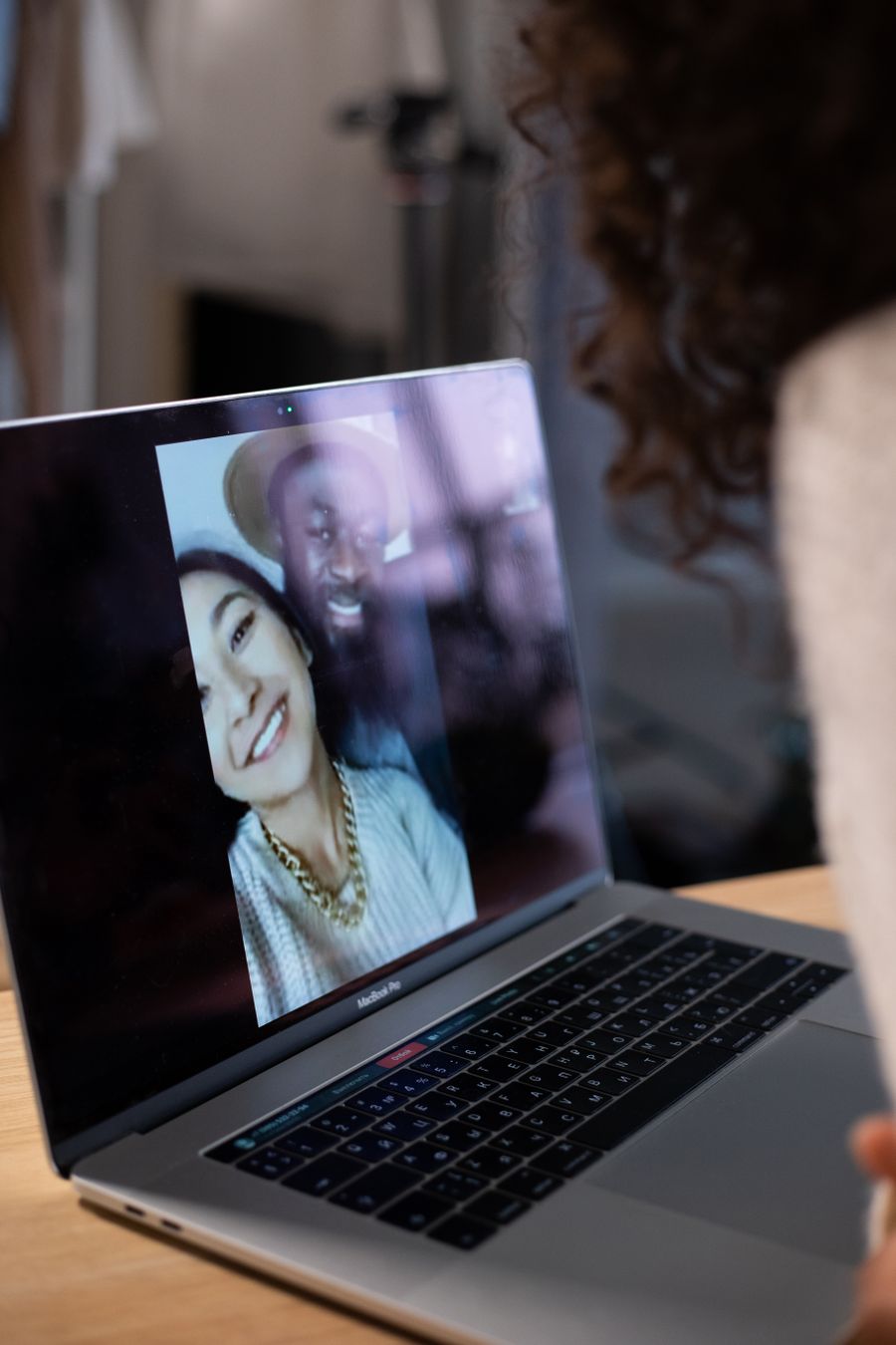 crop woman making video call on laptop — 旅の途中でデータ残量が低下?ワンタップチャージへご案内します。