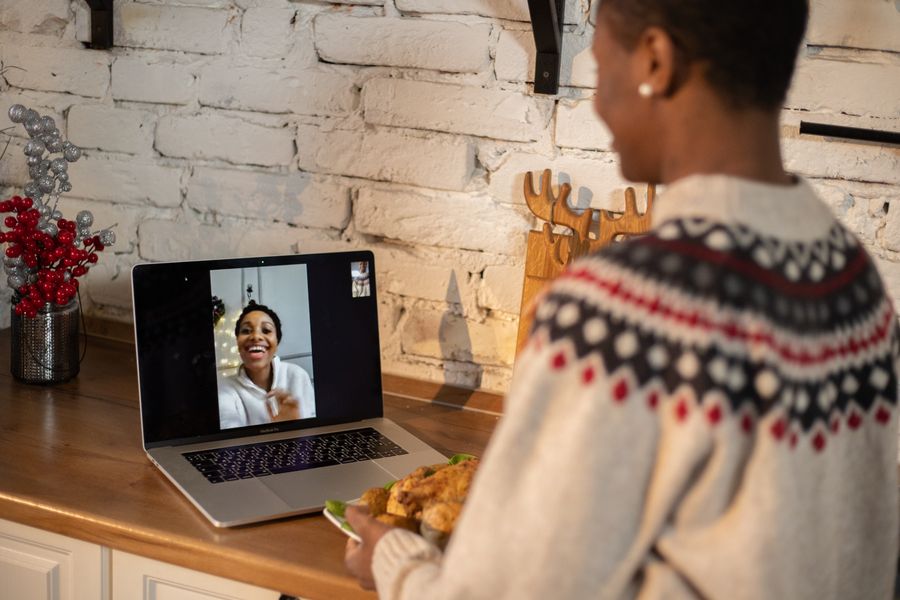 woman standing in front of a laptop — Inputs are validated as you type — mistakes get caught before they become wrong answers.