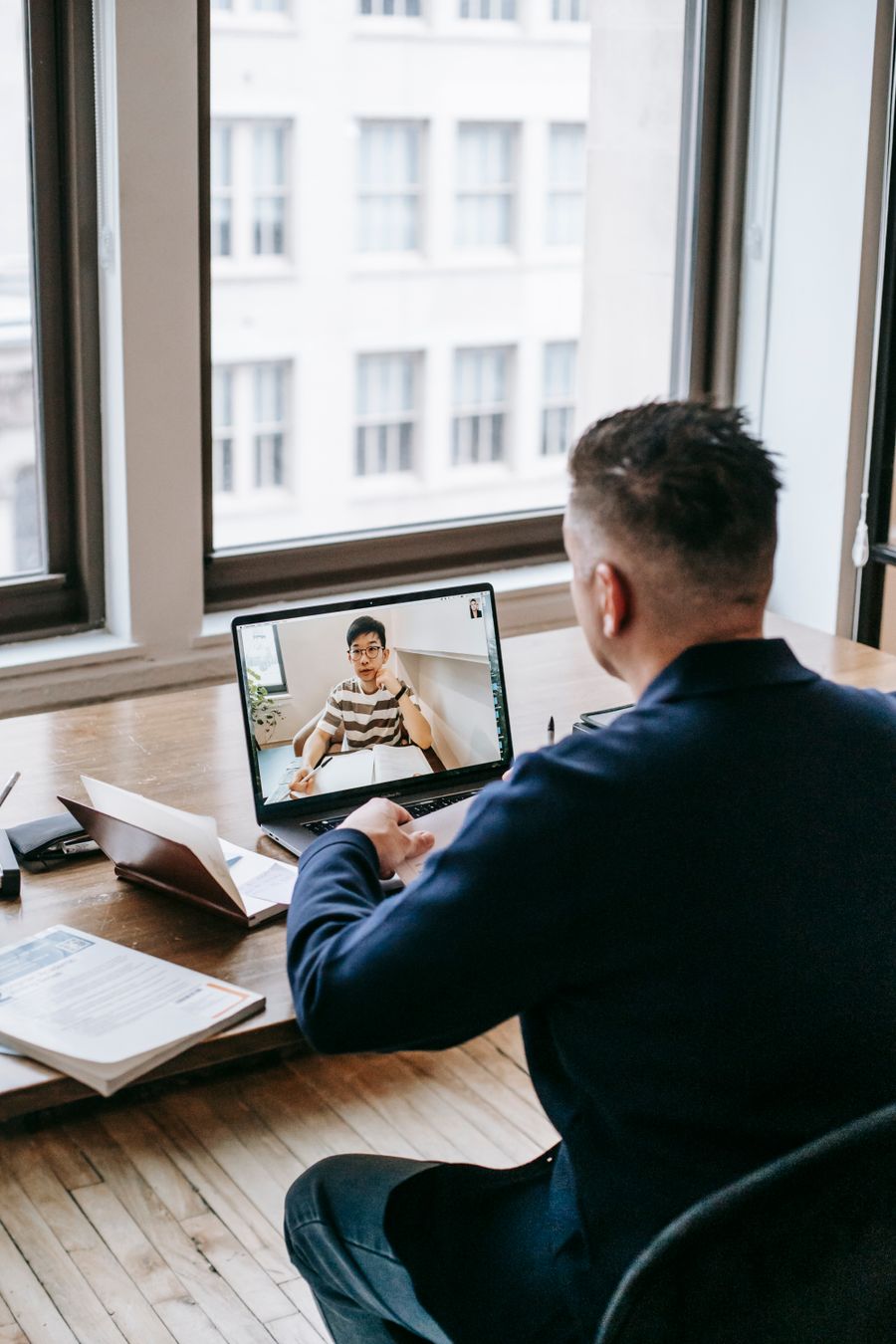 photo of man using laptop