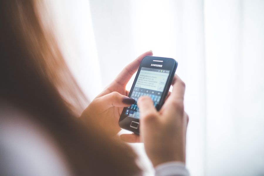 girl using mobile phone — Museum afternoons with audio guides streaming, not buffering.