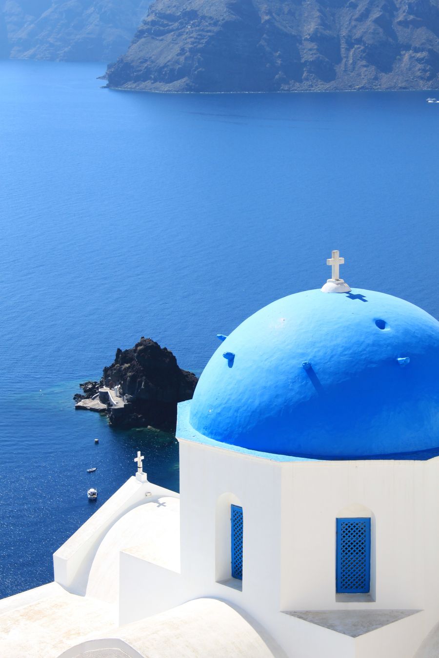 white and blue church near the ocean — Hiking the ridge: trail map offline, emergency numbers saved.