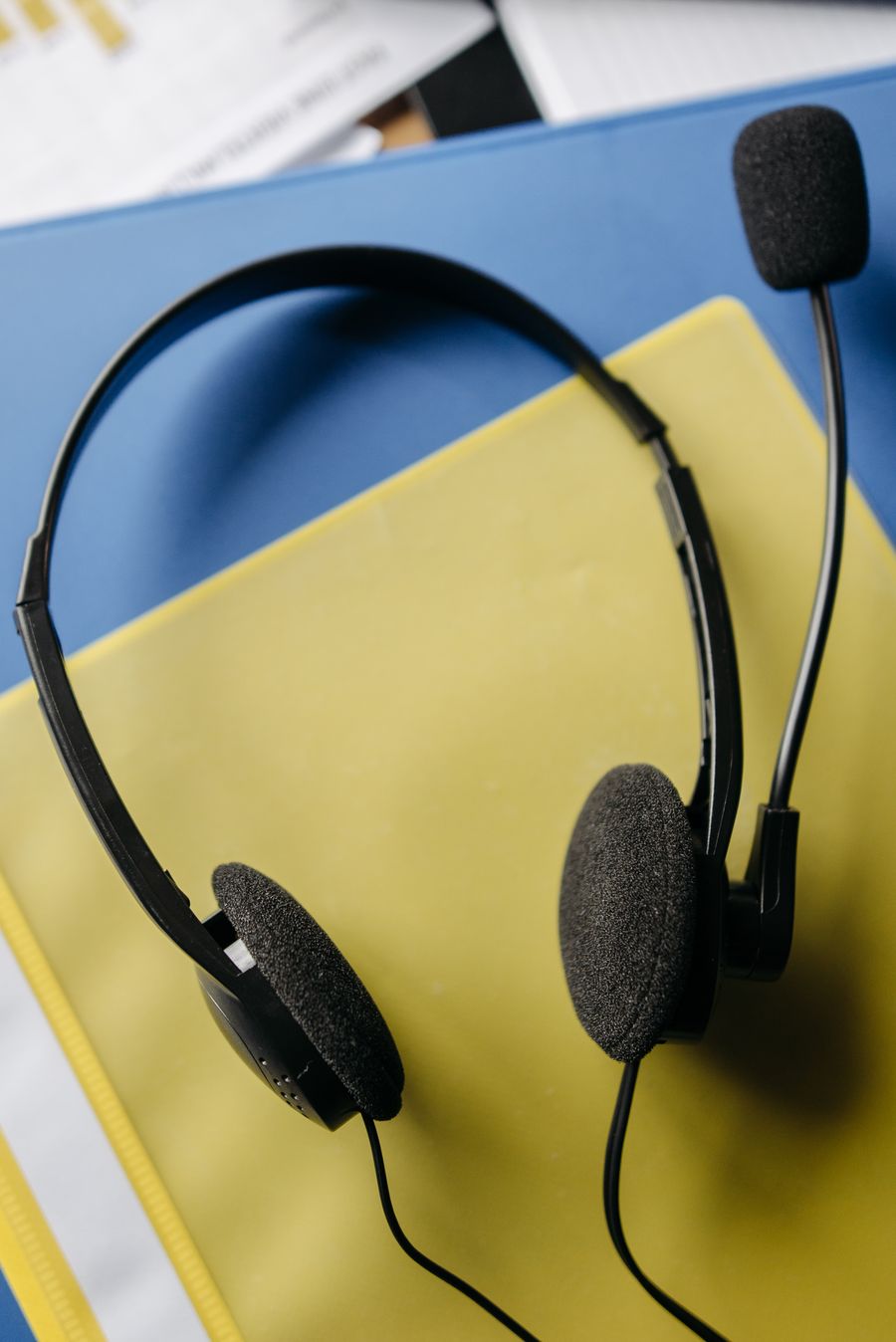 black corded headphones on yellow surface