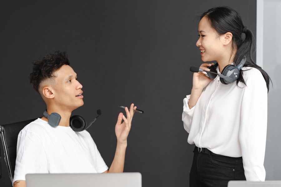 man and woman in white clothes wearing headset — Golden hour, fully online — photo backups upload before dinner.