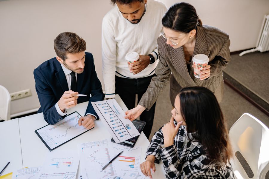 businesspeople looking at a business graph — From question to next step: this tool shortens the path to a decision.