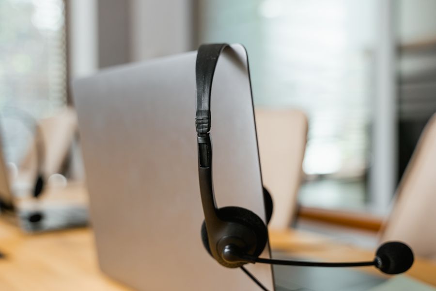 black headset with mouthpiece — Low-Data Alert: one question, answered well, instead of ten open tabs.