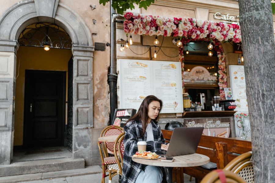 woman using laptop at a cafe