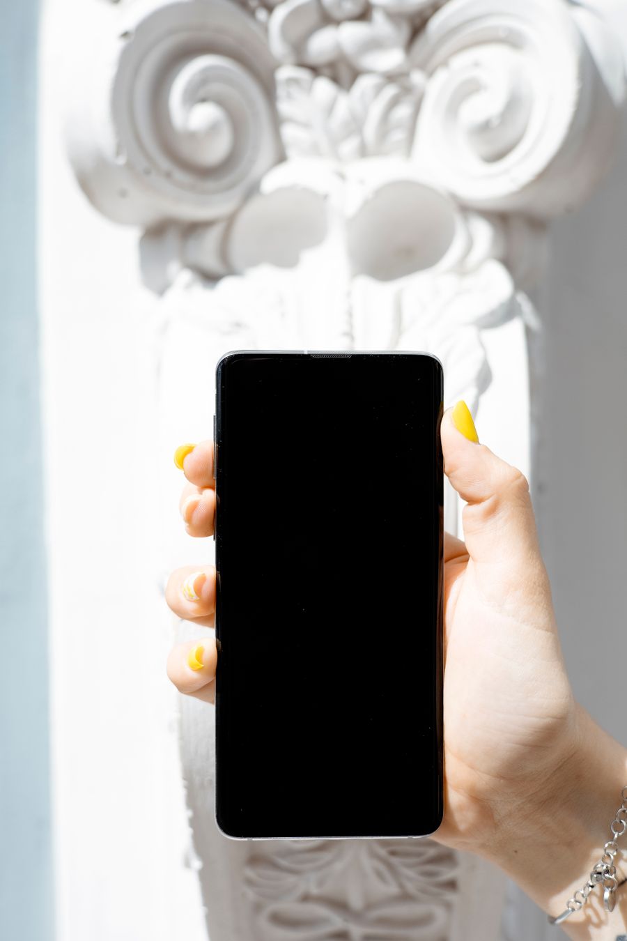 person holding a smartphone — From My Active eSIMs's answer to checkout is a short, well-lit path.